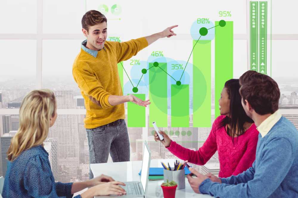 A presenter outlines data charts and graphs in a modern office, while colleagues engage in discussion related to Real Estate Investment.